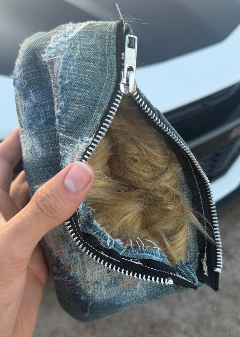 repaired denim clutch