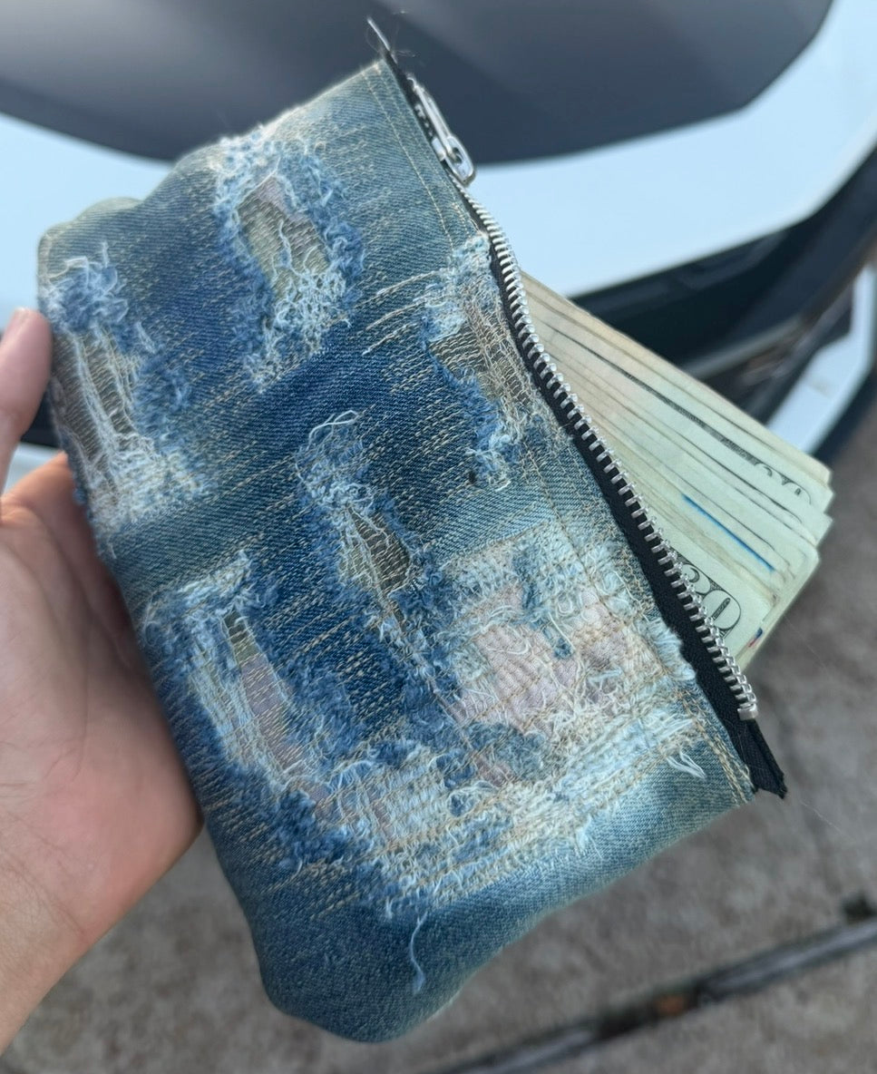 repaired denim clutch
