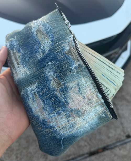 repaired denim clutch